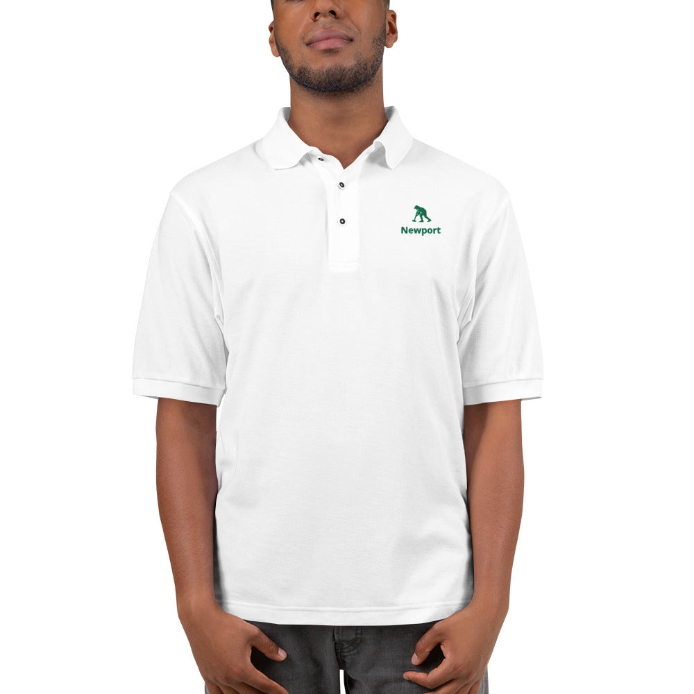 man in a white collared three button polo shirt with a logo of a man striking a croquet ball on the left chest.
