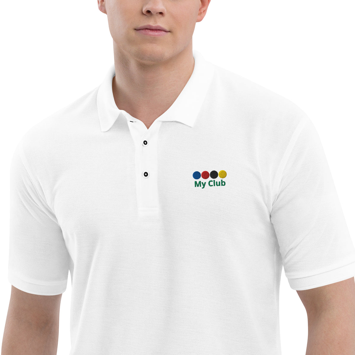 a man in a white collared three button polo shirt wth a logo of 4 croquet balls on the left chest