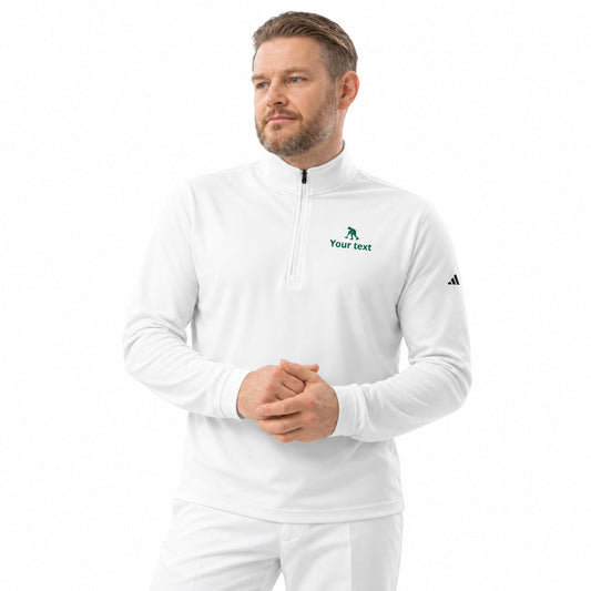A man wearing a white long-sleeve  Adidas quarter-zip pullover with a green croquet striker logo on the left chest 