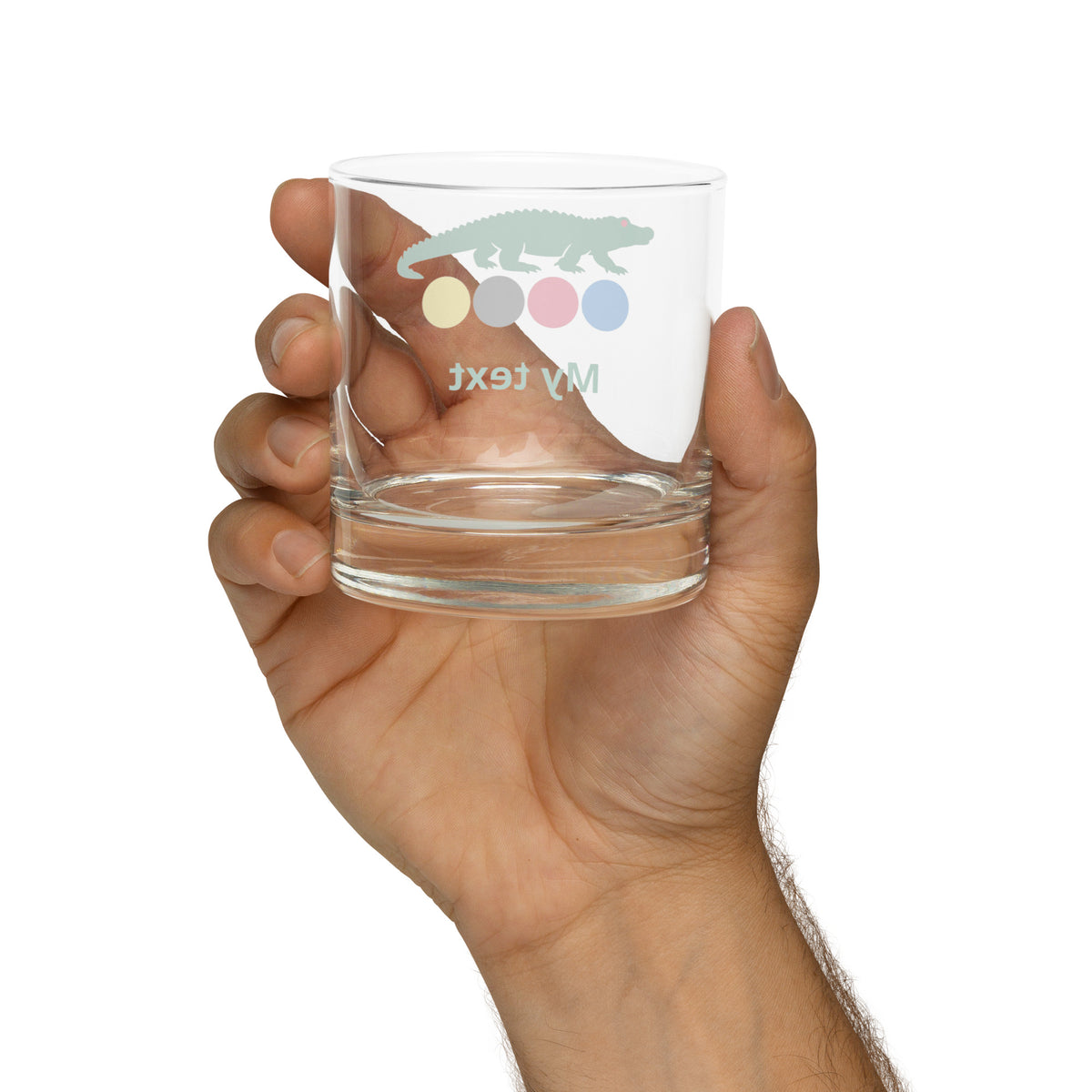 rocks glass with a croquet logo