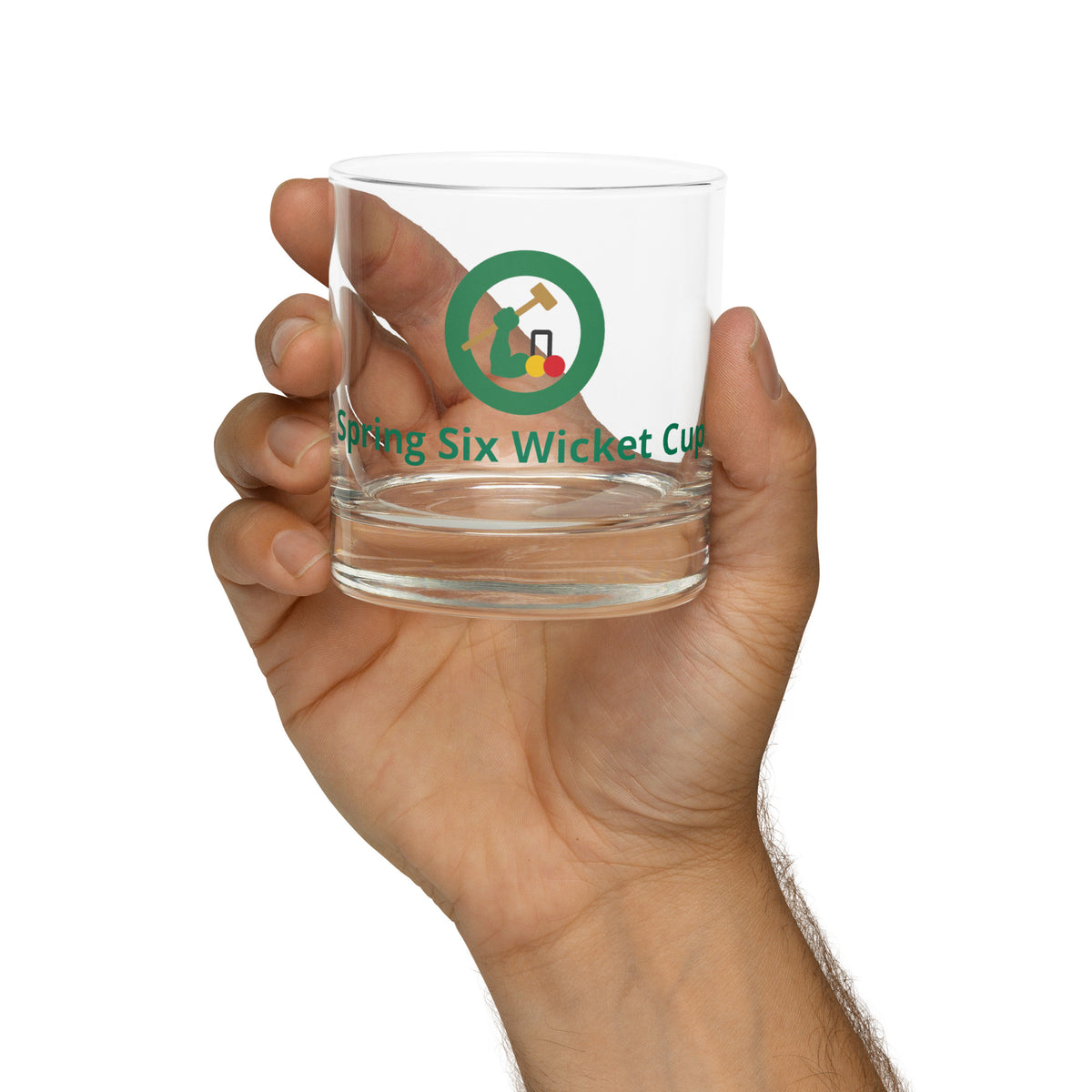 rocks glass with a croquet logo