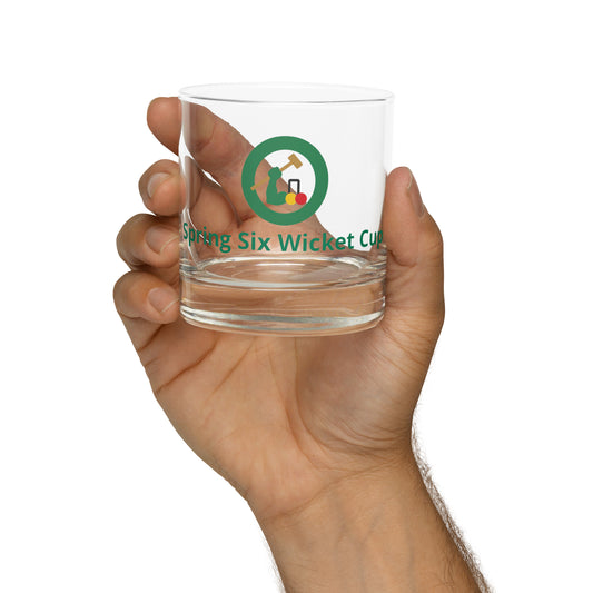 rocks glass with a croquet logo