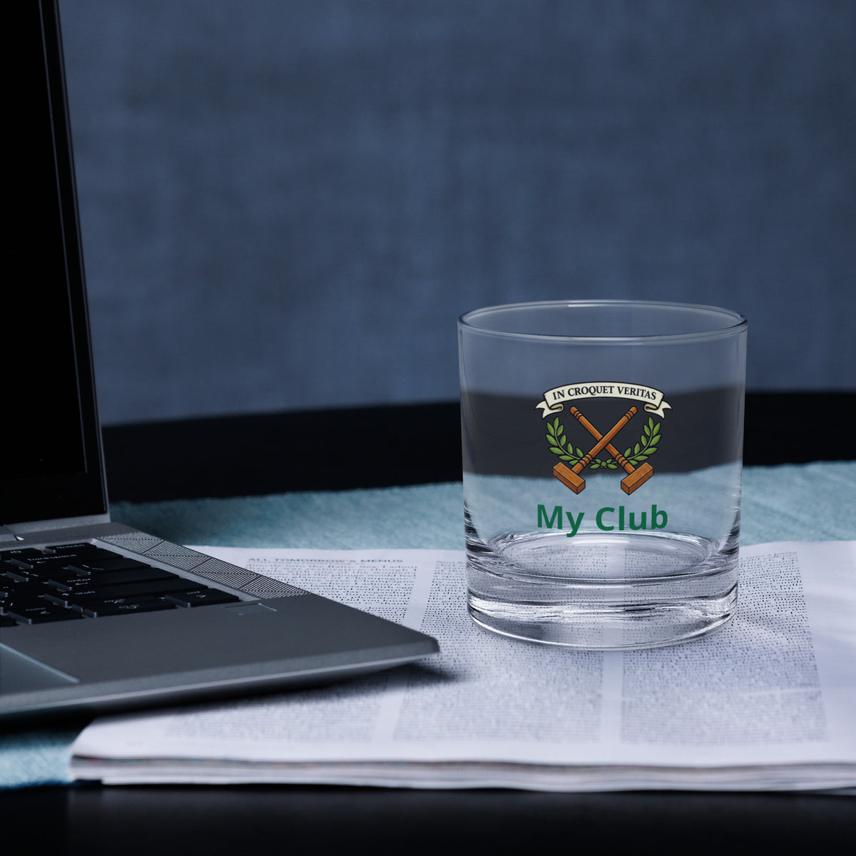 rocks glass with a croquet logo