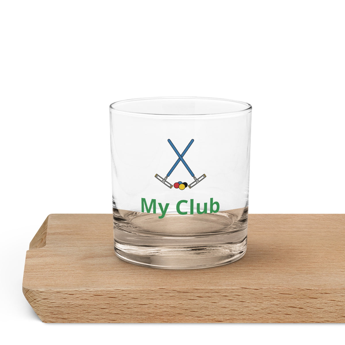 A rock highball glass with a crossed croquet mallets logo
