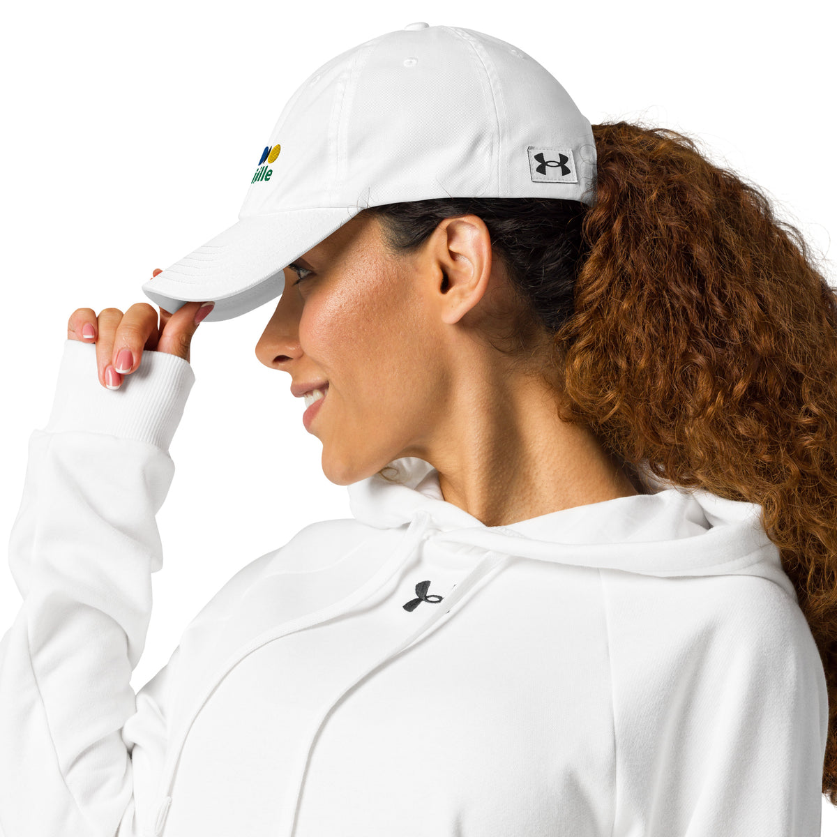 woman in a white cap with a croquet logo