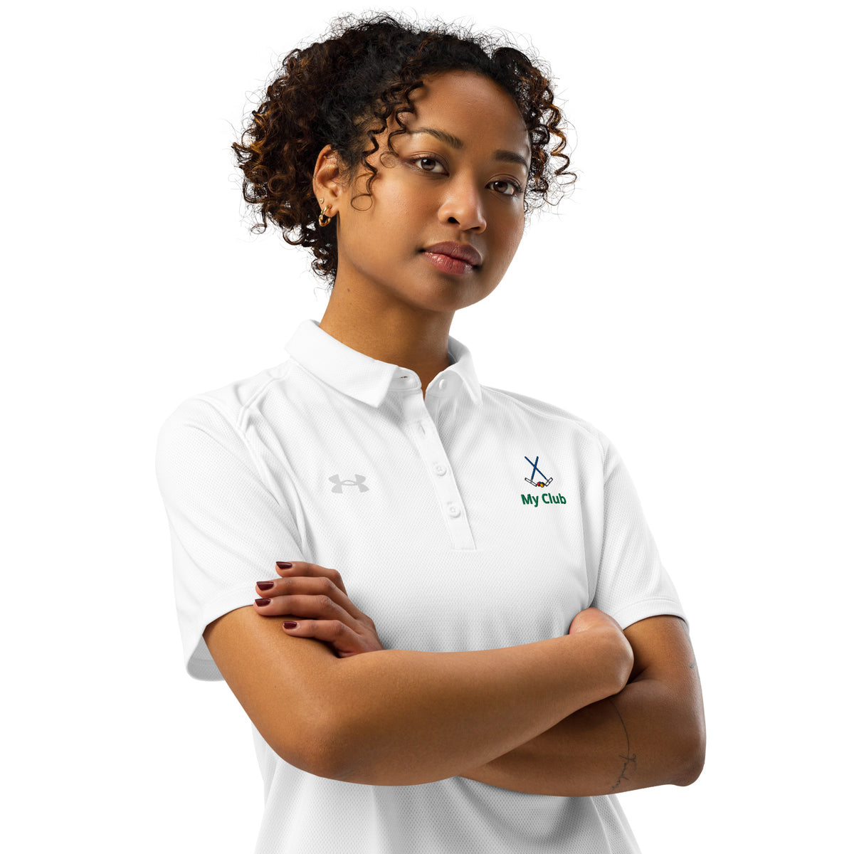 A woman wearing a white collared three button short-sleeve polo shirt with a green embroidered logo of  crossed croquet mallets on the left chest.